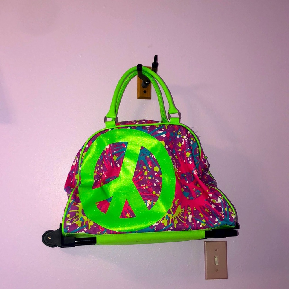 Justice tie-dye rolling suitcase